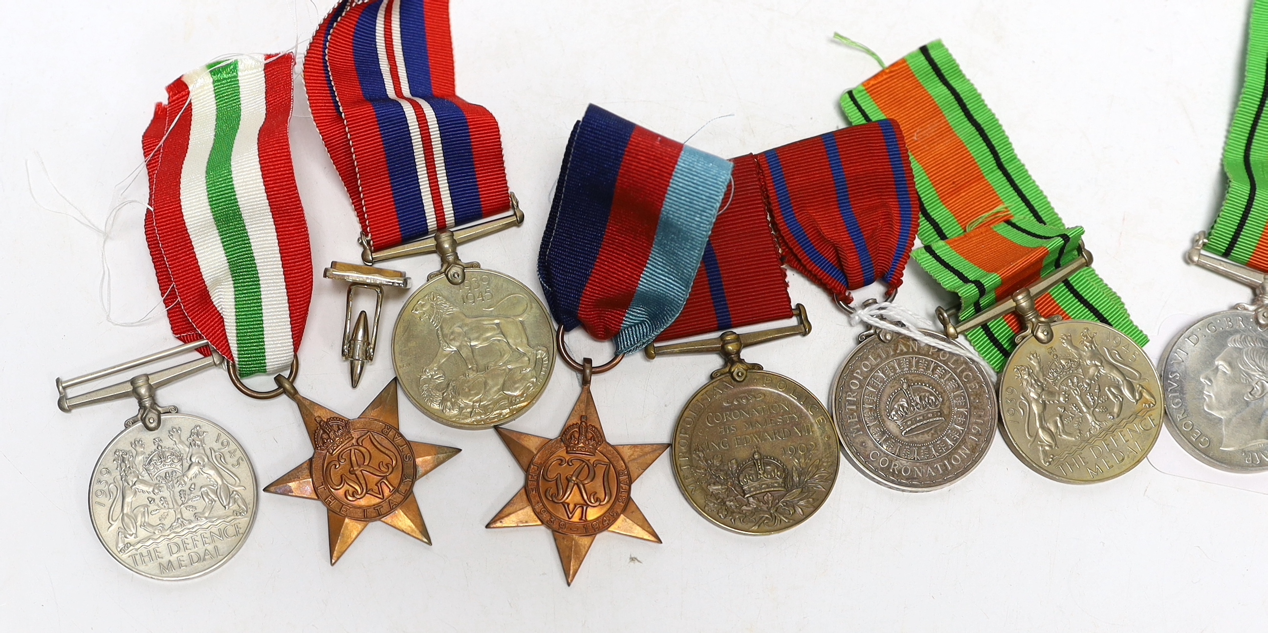 Group of assorted medals including; a pair of Metropolitan Police Coronation medals for 1902 and 1911 to P.S. A. Grunsell P. Div., together with six WWII medals; three Defence Medals, a War Medal, a 1939-45 Star and an I